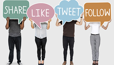 Diverse people holding texts of social media activities